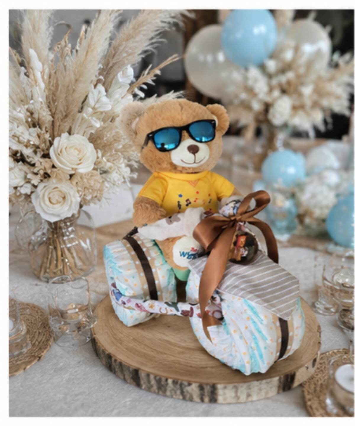 Nappy trike design in warm neutrals with a yellow-shirted teddy